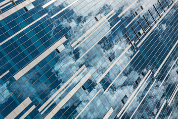 reflection of the sky and clouds in building windows