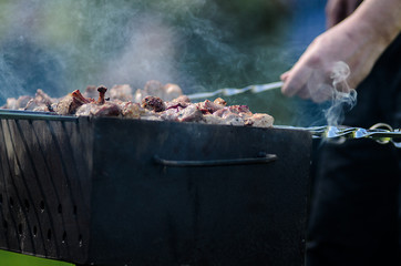 Cooking on the barbecue grill. Outdoor weekend time.