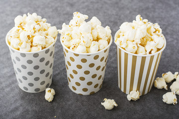 Christmas decorations in the composition of natural wicker basket on dark wooden background from shretskih nuts, pomegranate, red  tree balls, fir branches and snow