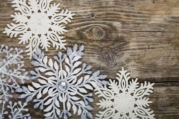 Christmas ornaments on the wooden background.
