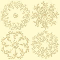 Set of 4 round decorative leaves compositions.