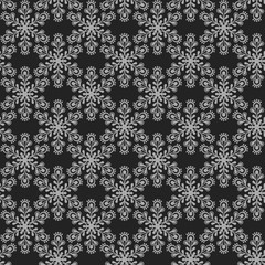 Seamless pattern with grey snowflakes on black background.