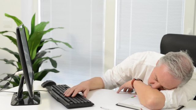 Sad businessman in front of his computer