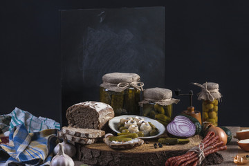 Herrings Pickles. Salted Cucumbers still-life with dark bread