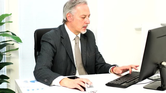 Bored businessman looking at his watch