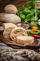 Fototapeta na wymiar Sliced ciabatta bread on cutting board.