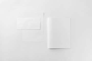 Corporate stationery set mockup at white textured paper background.