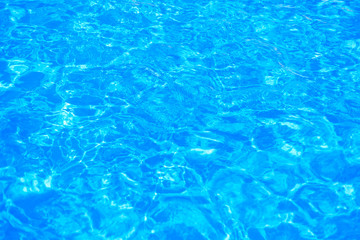Hotel swimming pool with sunny reflections
