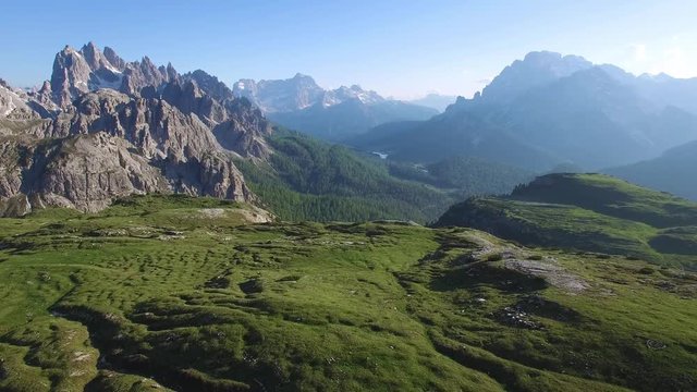 AERIAL VIEW: flight over National Park Tre Cime Di Lavaredo. Italian Dolomite.camera moving backwards