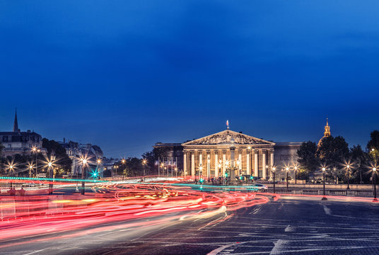 Fototapeta The Bourbon Palace is the place where National Assembly meets. It located on the left bank of the Seine, across from the Place de la Concorde. Paris cityscape night view.