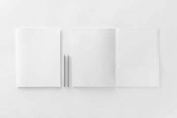 Corporate stationery set mockup at textured white paper background.