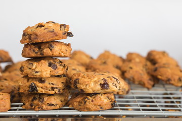 Chocolate chip cookies on a tray rack,Fresh baked cookies,Stacked chocolate chip cookies.