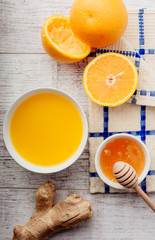 orange juice with honey and ginger closeup