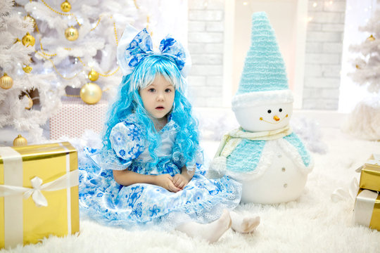 Girl in Christmas costumes for 