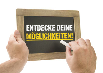 Entdecke Deine Möglichkeiten! Hand schreibt Tafel