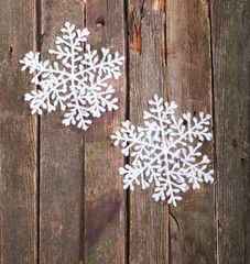 White snowflake on a wall from old boards