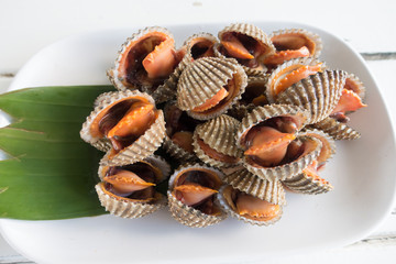 Delicious boiled or steamed cockles on white place

