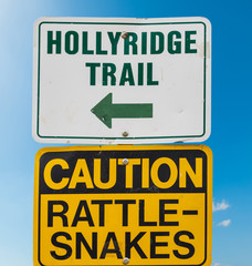 Fototapeta premium HOLLYRIDGE TRAIL and CAUTION RATTLE SNAKES signs