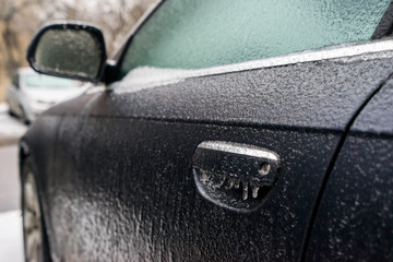Car covered with ice after freezing rain