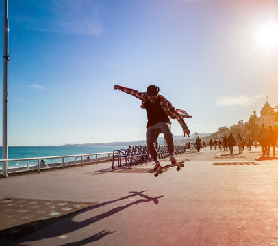 Silhouette of skateboarder in city