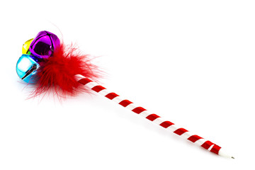 Beautiful pen with bells and feathers isolated on white
