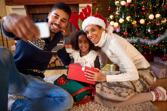Afro American family making selfie for Christmas