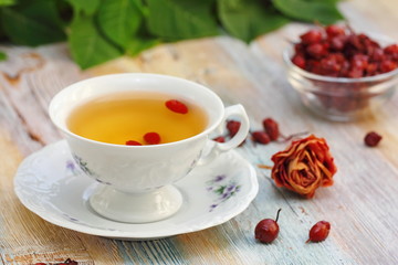 Tea with rosehip on a table. Useful drink for health. Herbal tea.