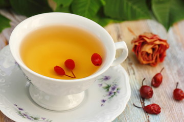 Tea with rosehip on a table. Useful drink for health. Herbal tea.