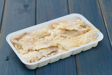 dry cod fish on plastic dish
