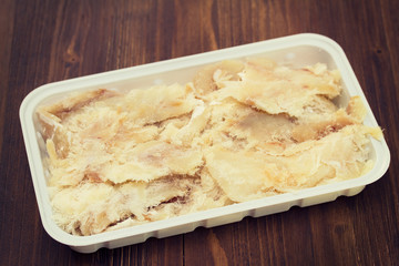 dry cod fish on plastic dish