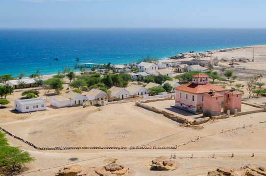 Small Fishing Village Mucuio With Dominating Portuguese Colonial Building In Angola