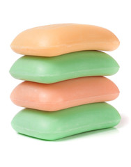 stack of soap  different colors isolated on white background