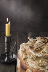 Festive baked bread on wooden background.