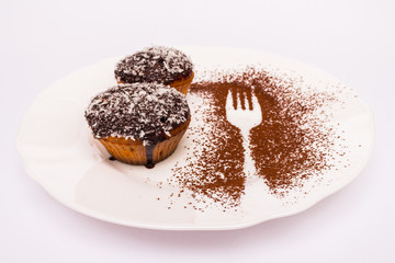 Cupcake with chocolate and coconut chips sprinkled on top isolated