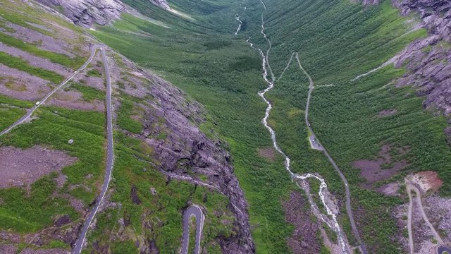 Troll's Path Trollstigen or Trollstigveien winding mountain road in Norway. Aerial footage