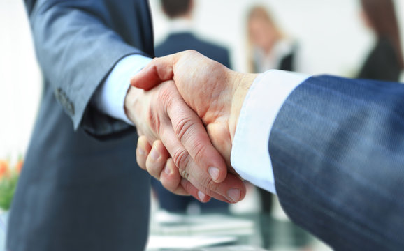 concept of cooperation.businessman handshake invites to cooperat