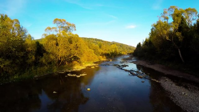 aerial shot of Green Valley during with River, autumn in Bieszczady, Poland