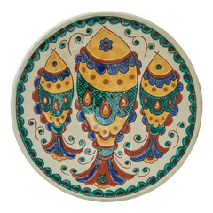 Covered with glaze ceramic plate handmade. Isolated on a white b