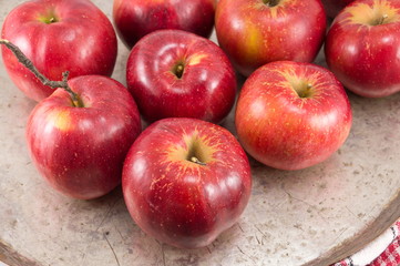 Freshly picked red apples on a plate