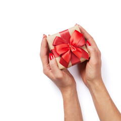 Hands holding christmas or valentines day gift