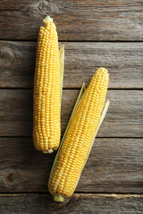 Sweet corns on a grey wooden table
