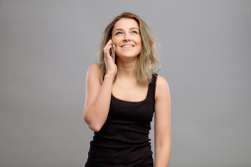 Woman talking mobile phone isolated