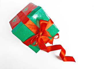 red and green Christmas gift with ribbon isolated