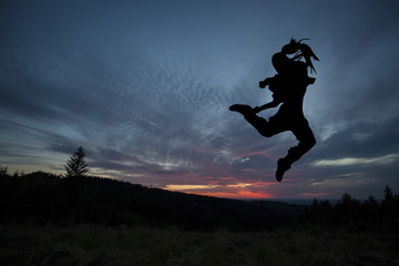 Fototapeta na wymiar Ballet dancer posing during the sunset