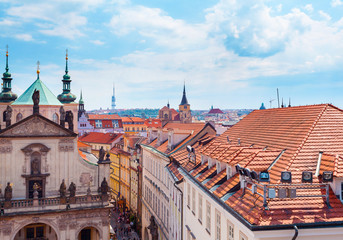 Obraz premium Panorama of the old part of Prague from the Old Town Bridge Tower. Old colorful Town architecture, Czech Republic.