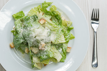Caesar salad with cheese and croutons
