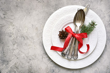 Christmas table place setting with christmas pine branches and p - obrazy, fototapety, plakaty
