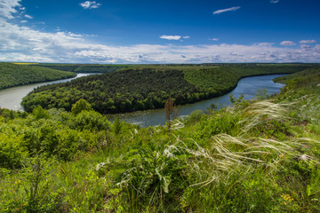 The scenic summer landscape. View of bend of the river. Panoramic view from the hill. 