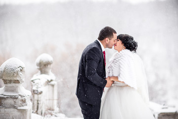 Winter wedding kiss