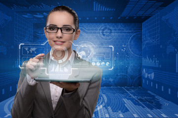 Businesswoman with tablet in business concept